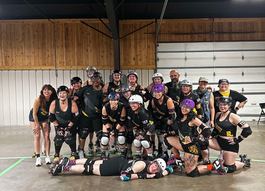 The Yellow Rose Roller Derby All Stars smiling in a group photo.